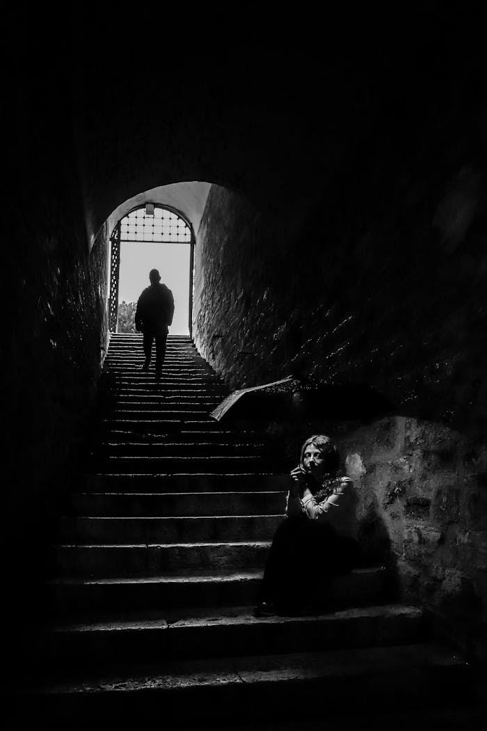 Moody silhouette and shadow play on a staircase in Istanbul, creating a dramatic farewell moment.